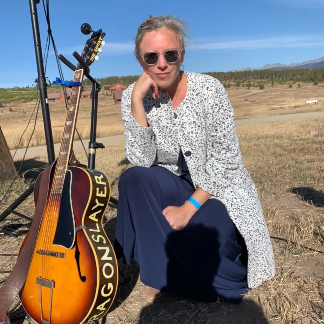 Sophie with her guitar at Snow Mountain Ranch