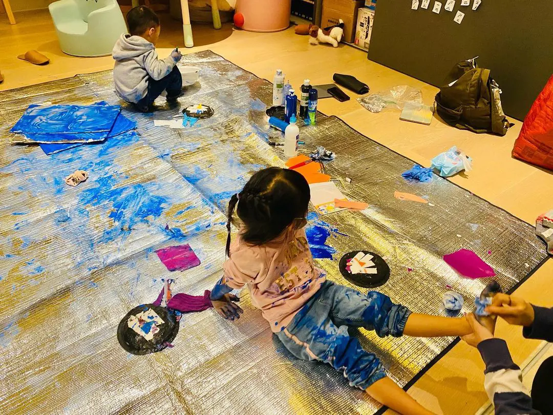 Chou children enjoying their time painting the house dirty