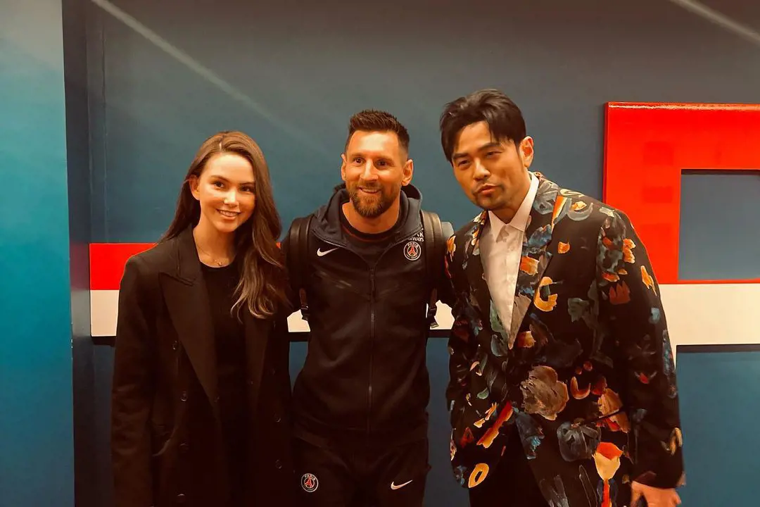 Hannah and her singer partner with football star Lionel Messi